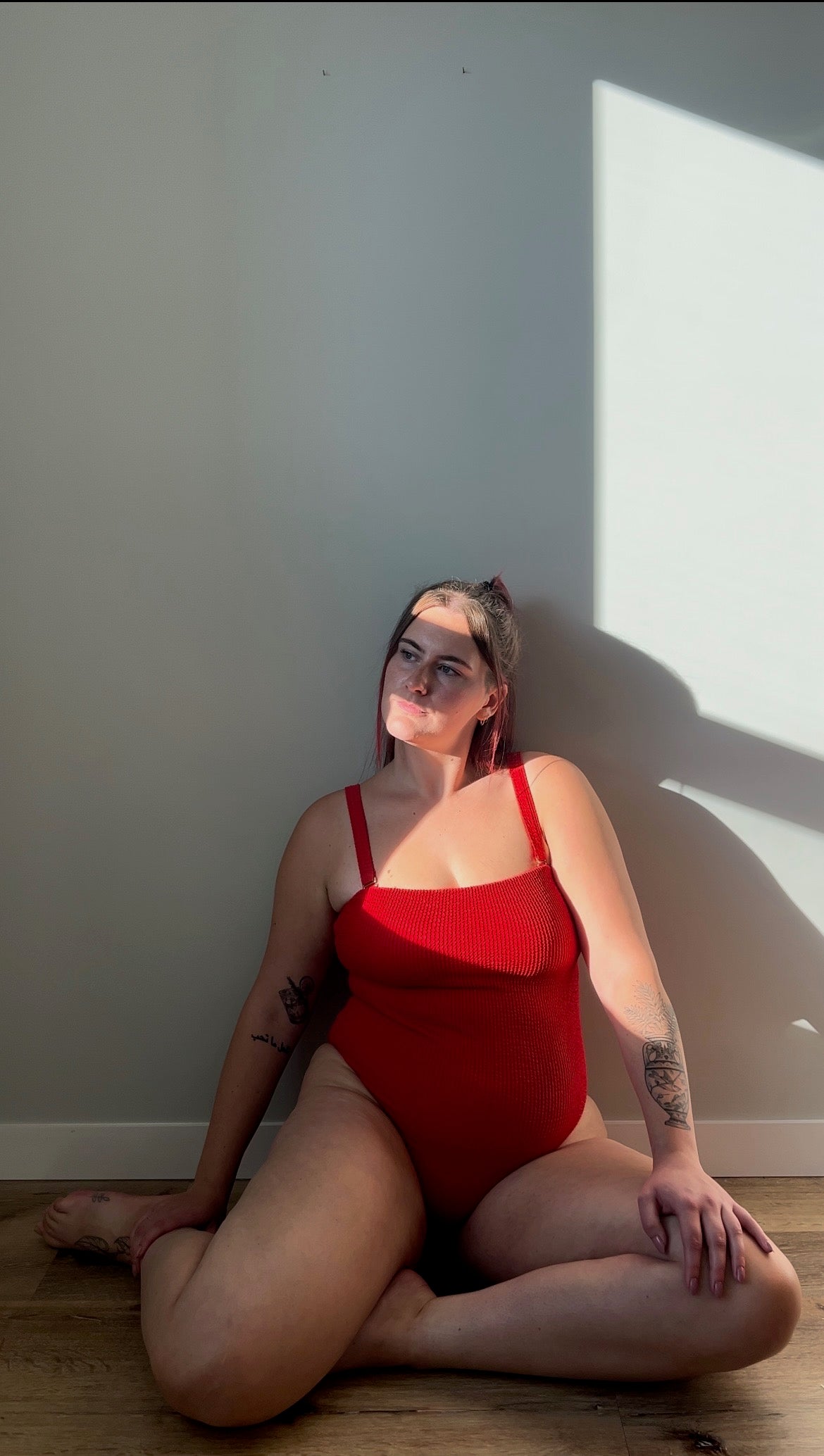 Square neck textured crinkle one piece with the straps connected in chili / red