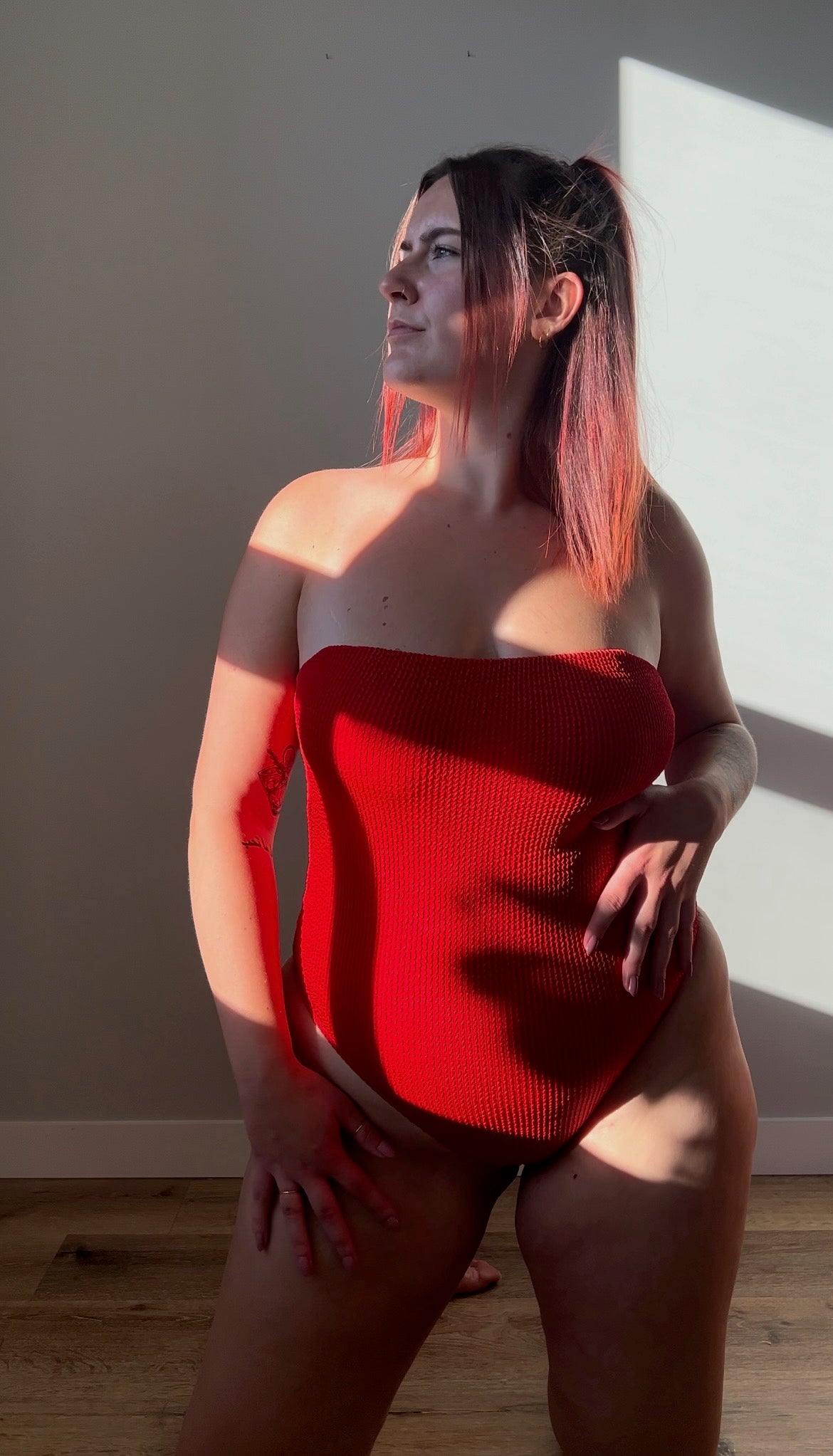 Red / chili one piece from the front close up. Model wears the square neck textured crinkle one piece, removable straps